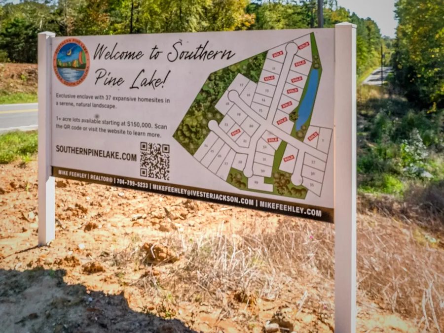 The Southern Pine Lake community sign showing the site plan and available homesites.